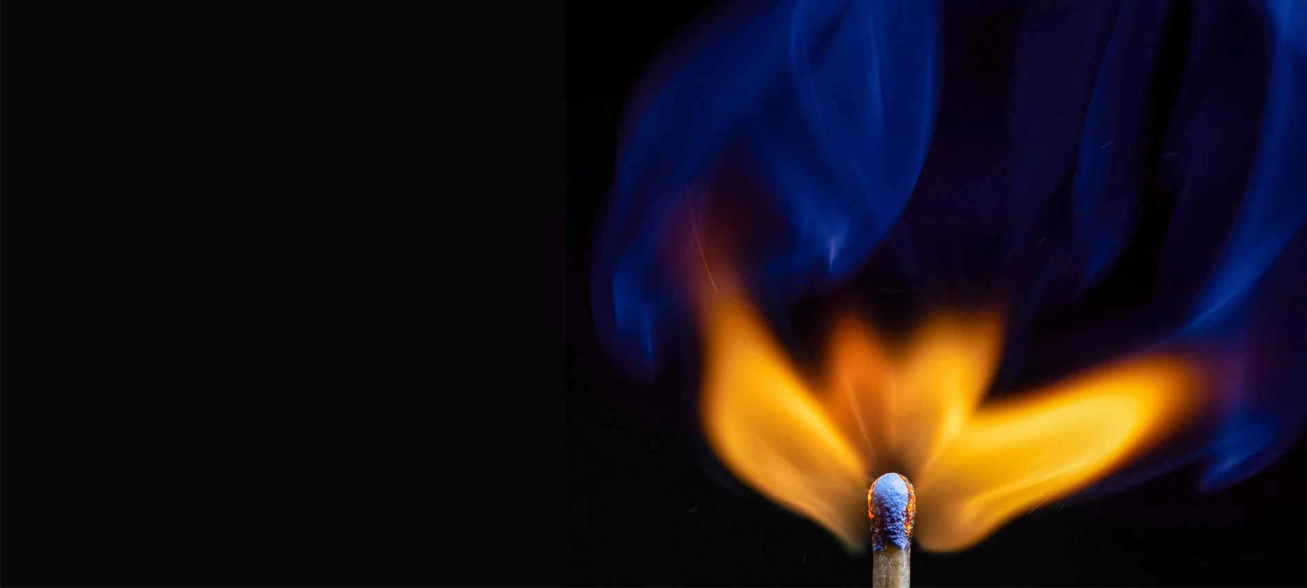 Close up photo of an ignited match with an orange and blue flame, representing Ignite Digital Services